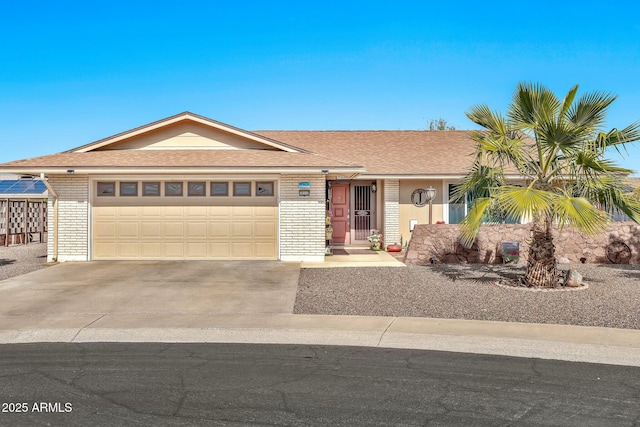 ranch-style home featuring a garage