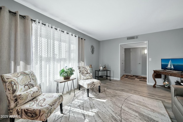 sitting room with light hardwood / wood-style flooring