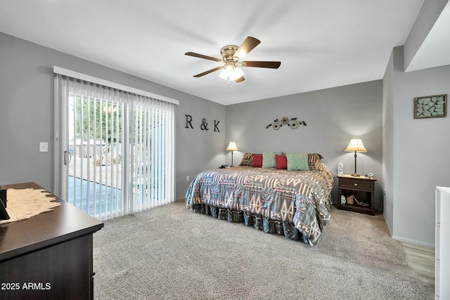 bedroom with access to exterior, carpet floors, and ceiling fan