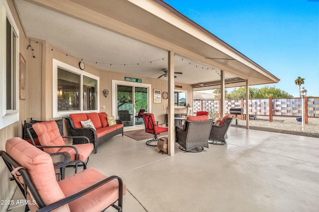 view of patio / terrace with an outdoor living space and ceiling fan