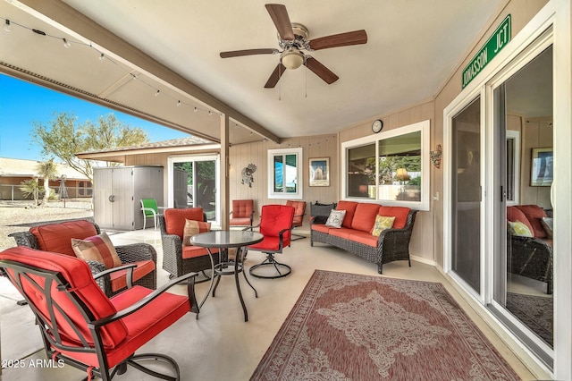 view of patio with an outdoor living space and ceiling fan