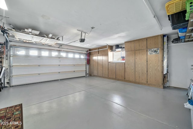 garage featuring a garage door opener