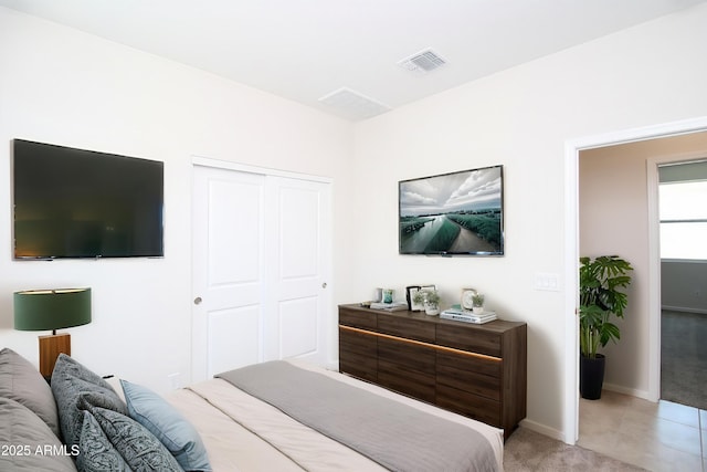 17419 W Via De Luna Dr, Surprise, AZ 85387 - bedroom with a closet, light carpet, and baseboards