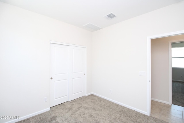 17419 W Via De Luna Dr, Surprise, AZ 85387 - unfurnished bedroom with carpet floors, a closet, and baseboards
