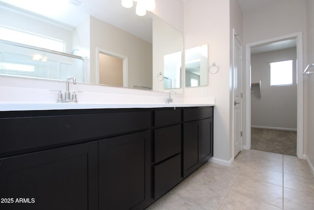 17419 W Via De Luna Dr, Surprise, AZ 85387 - full bathroom with double vanity, baseboards, tile patterned flooring, and a closet