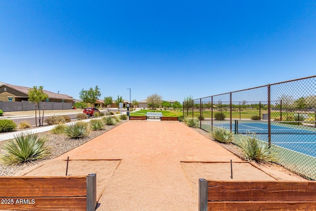 17419 W Via De Luna Dr, Surprise, AZ 85387 - view of home's community featuring a tennis court and fence