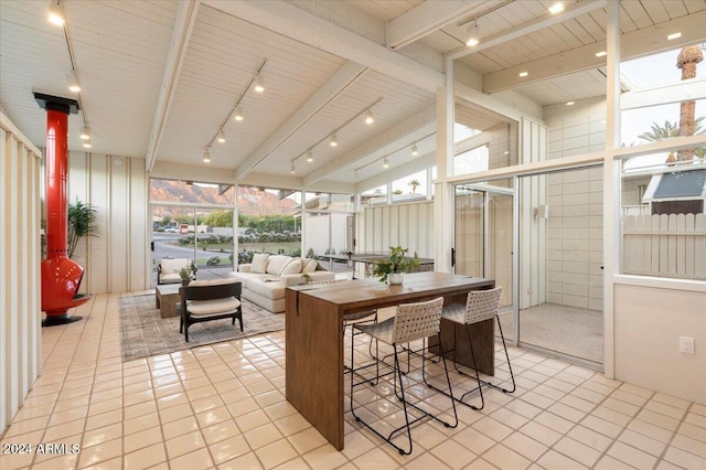 interior space featuring lofted ceiling with beams