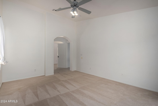 carpeted empty room featuring ceiling fan