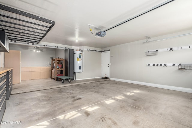 garage featuring electric water heater and a garage door opener