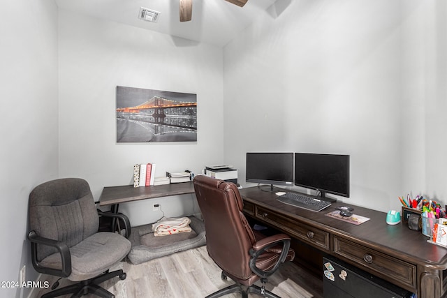 office space featuring ceiling fan and light hardwood / wood-style flooring