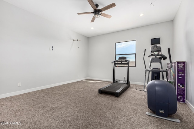 workout area with ceiling fan and carpet floors