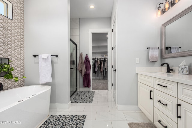 bathroom featuring vanity and separate shower and tub