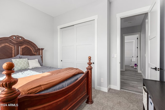 carpeted bedroom with a closet