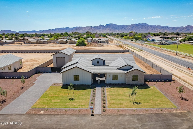 drone / aerial view featuring a mountain view