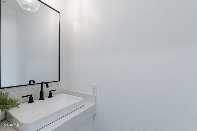 bathroom with vanity with extensive cabinet space