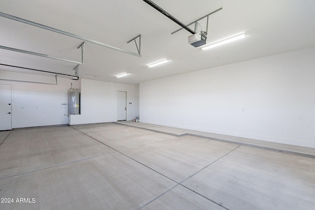 garage with water heater and a garage door opener