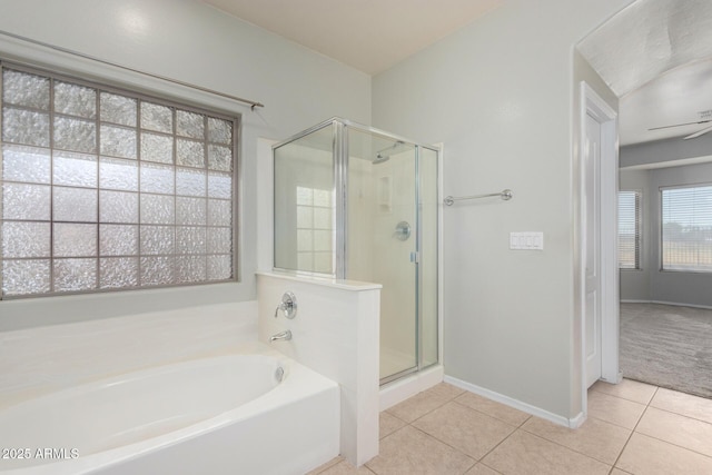 bathroom featuring tile patterned floors and separate shower and tub