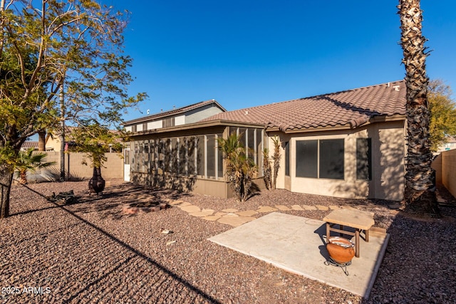 back of house with a patio