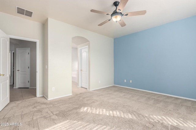 empty room featuring light carpet and ceiling fan