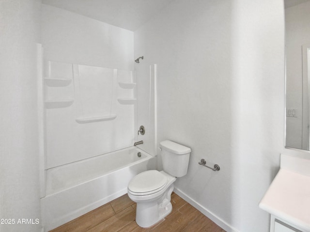 full bathroom with toilet, tub / shower combination, hardwood / wood-style floors, and vanity