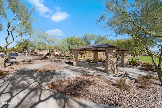 surrounding community featuring a playground and a gazebo