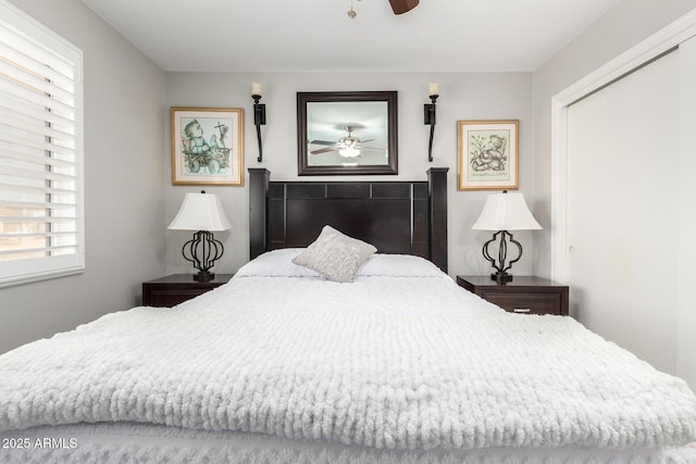 bedroom with a ceiling fan and a closet