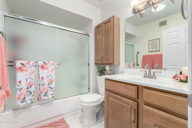 full bath featuring toilet, visible vents, combined bath / shower with glass door, and vanity