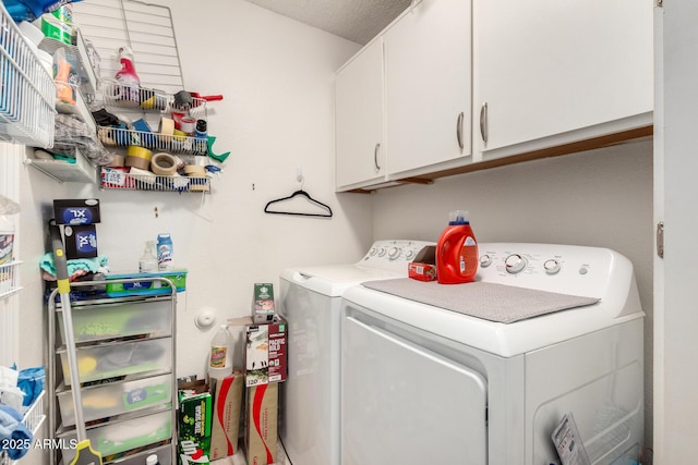 laundry room featuring cabinet space and separate washer and dryer