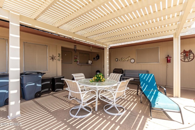 view of patio / terrace with a pergola and outdoor dining space