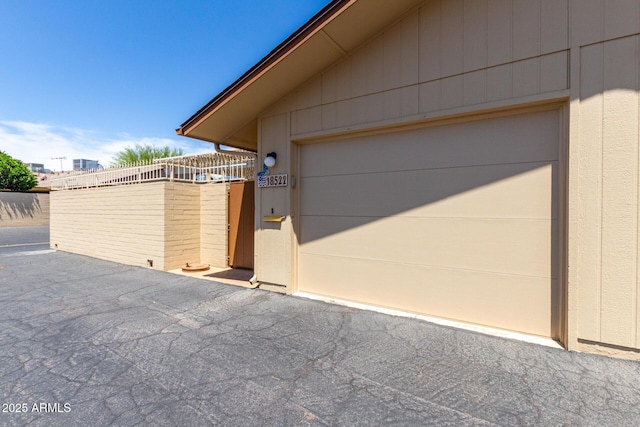 garage with fence