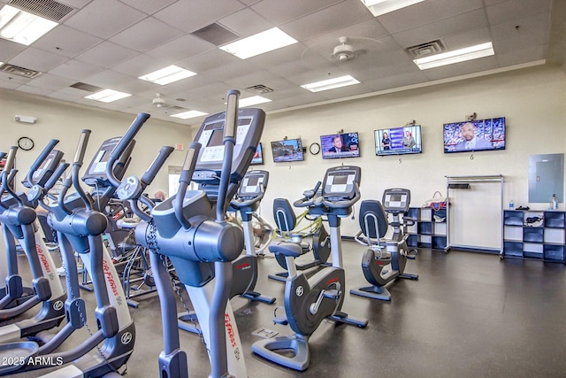 exercise room featuring visible vents and a paneled ceiling