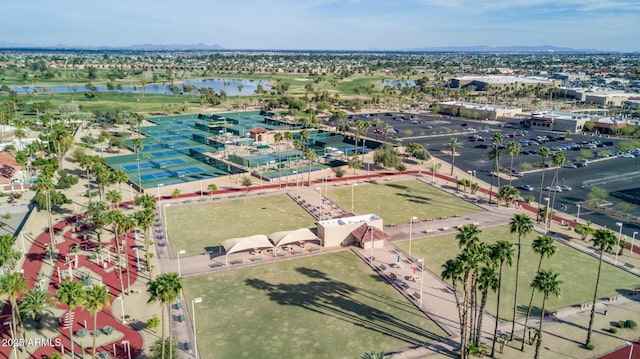 birds eye view of property with a water and mountain view