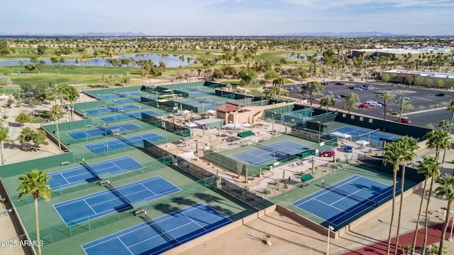 aerial view featuring a water view and golf course view