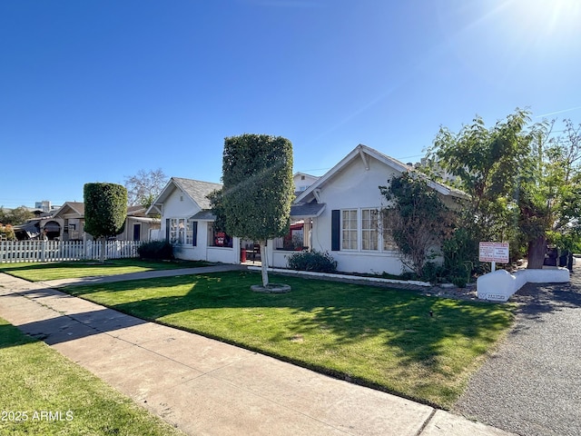 ranch-style home with a front yard