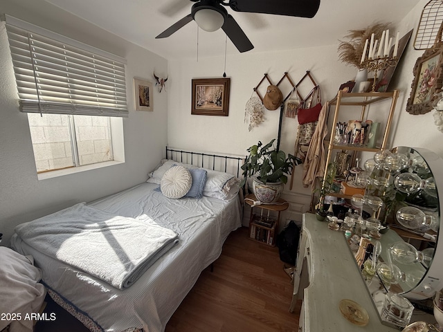 bedroom featuring dark wood-type flooring and ceiling fan