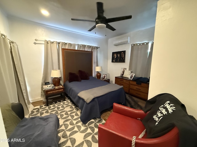 bedroom featuring ceiling fan and a wall unit AC