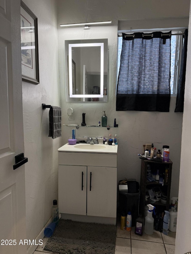 bathroom with vanity and tile patterned flooring