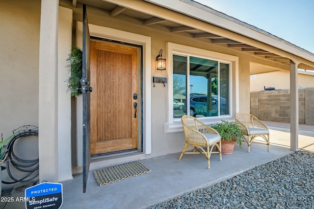 property entrance featuring a patio