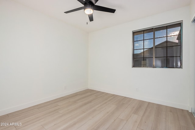 spare room featuring ceiling fan and light wood-type flooring