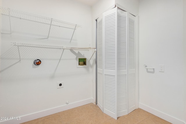 washroom with gas dryer hookup, hookup for a washing machine, tile patterned floors, and electric dryer hookup