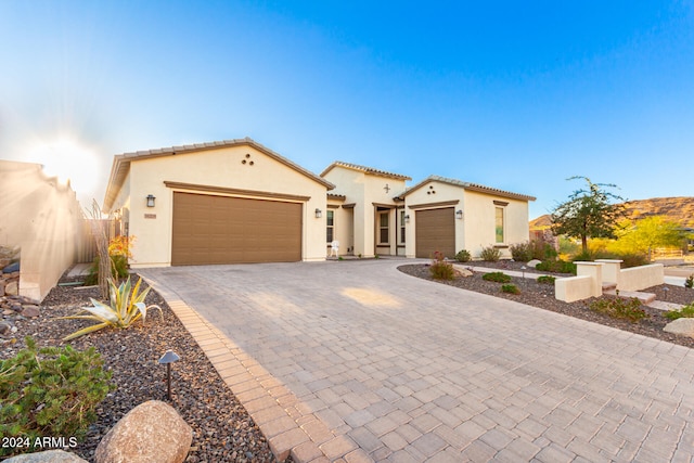 mediterranean / spanish house with a garage