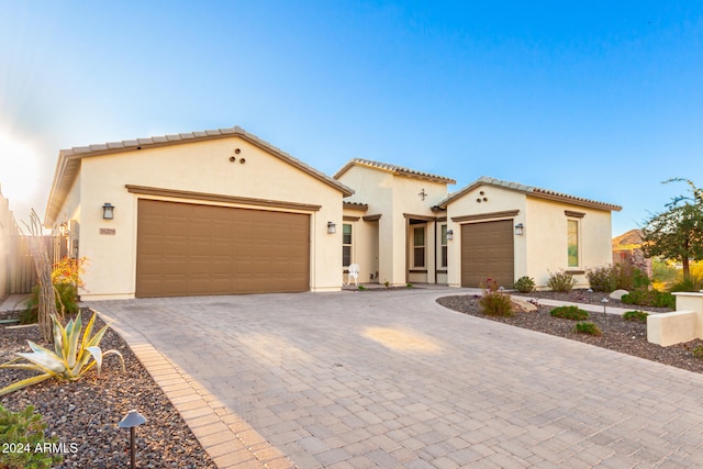 mediterranean / spanish-style house featuring a garage