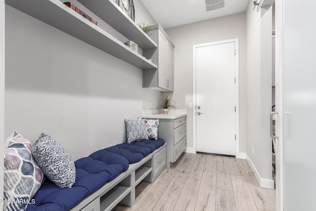 mudroom with light hardwood / wood-style floors