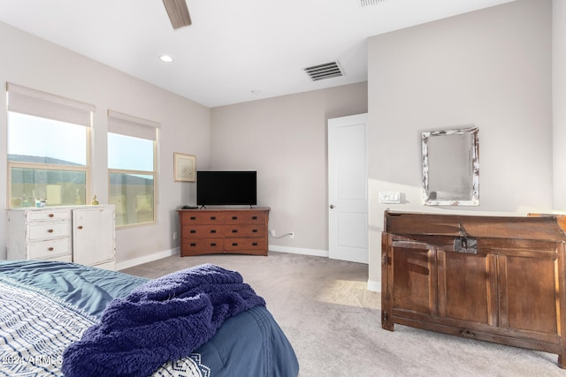 bedroom featuring light carpet and ceiling fan