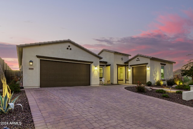 mediterranean / spanish house featuring a garage