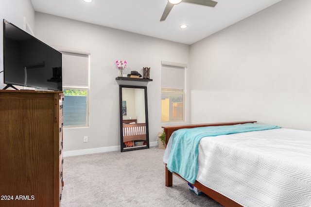 carpeted bedroom featuring ceiling fan