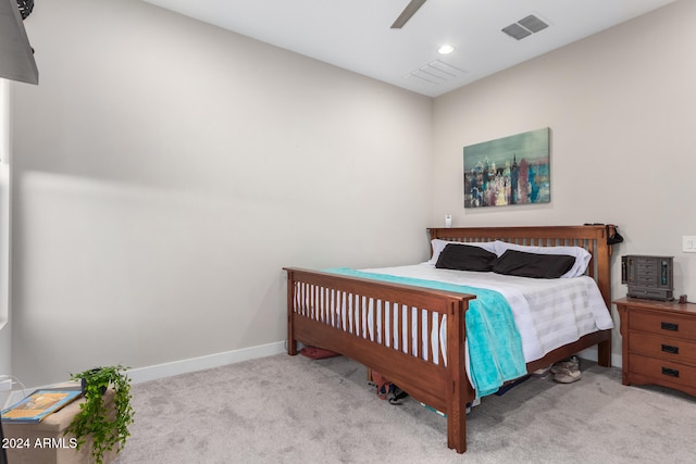 bedroom with light carpet and ceiling fan