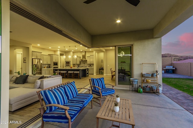 patio terrace at dusk with an outdoor kitchen