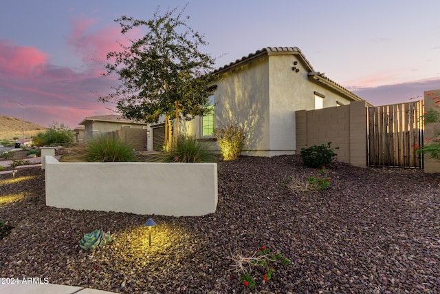 view of property exterior at dusk