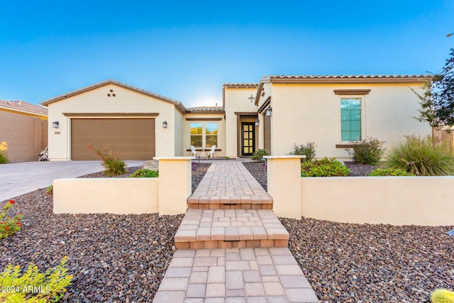 mediterranean / spanish house featuring a garage